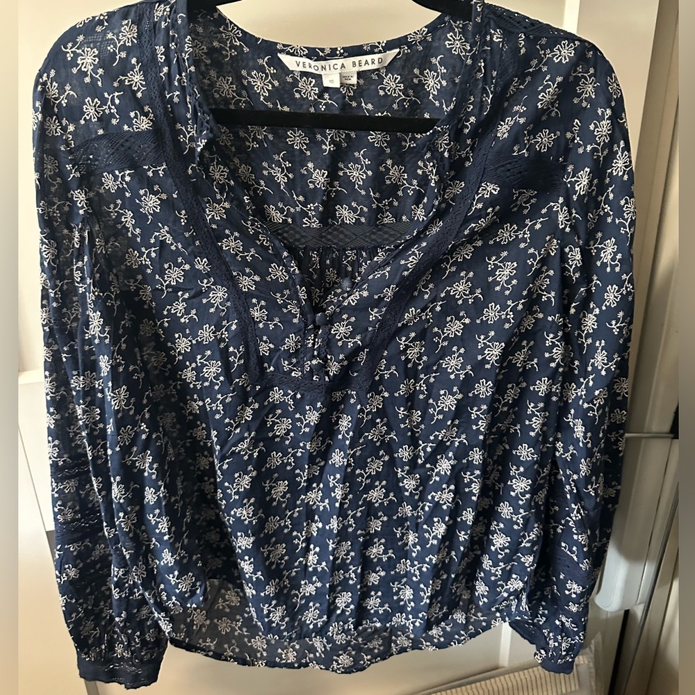 Beautiful Veronica Beard blouse with white flowers.